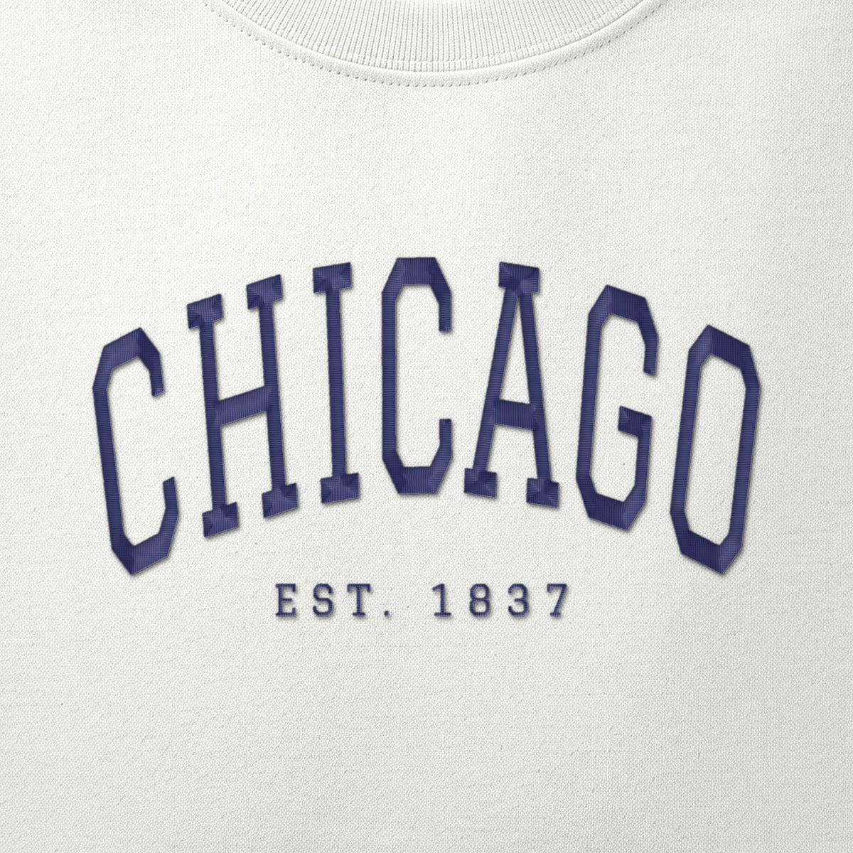 Close-up of navy satin-stitch Chicago embroidery
