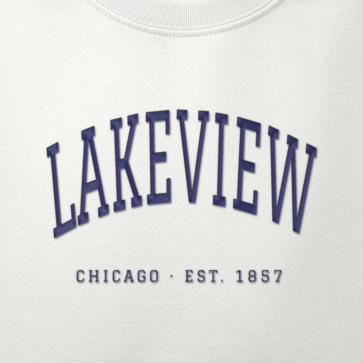 Close-up of navy satin-stitch Lakeview embroidery