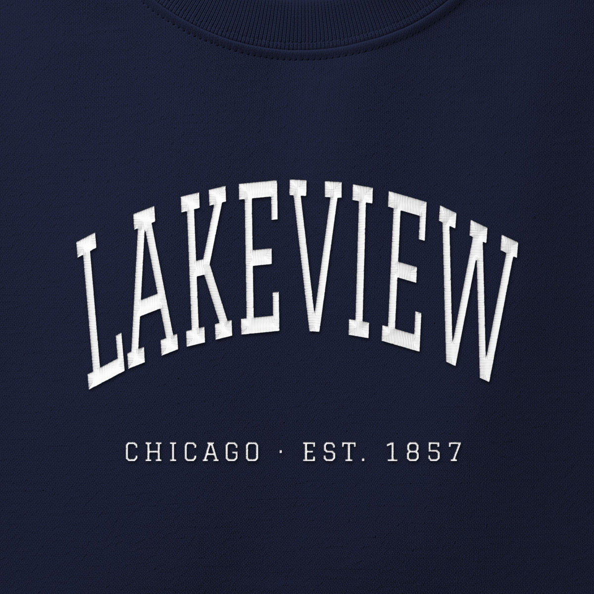 Close-up of white satin-stitch Lakeview embroidery