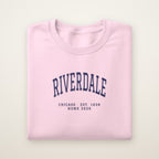 Riverdale Chicago Home 2026 Embroidered Crewneck — Navy Thread on Light Pink