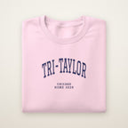 Tri-Taylor Chicago Home 2026 Embroidered Crewneck — Navy Thread on Light Pink