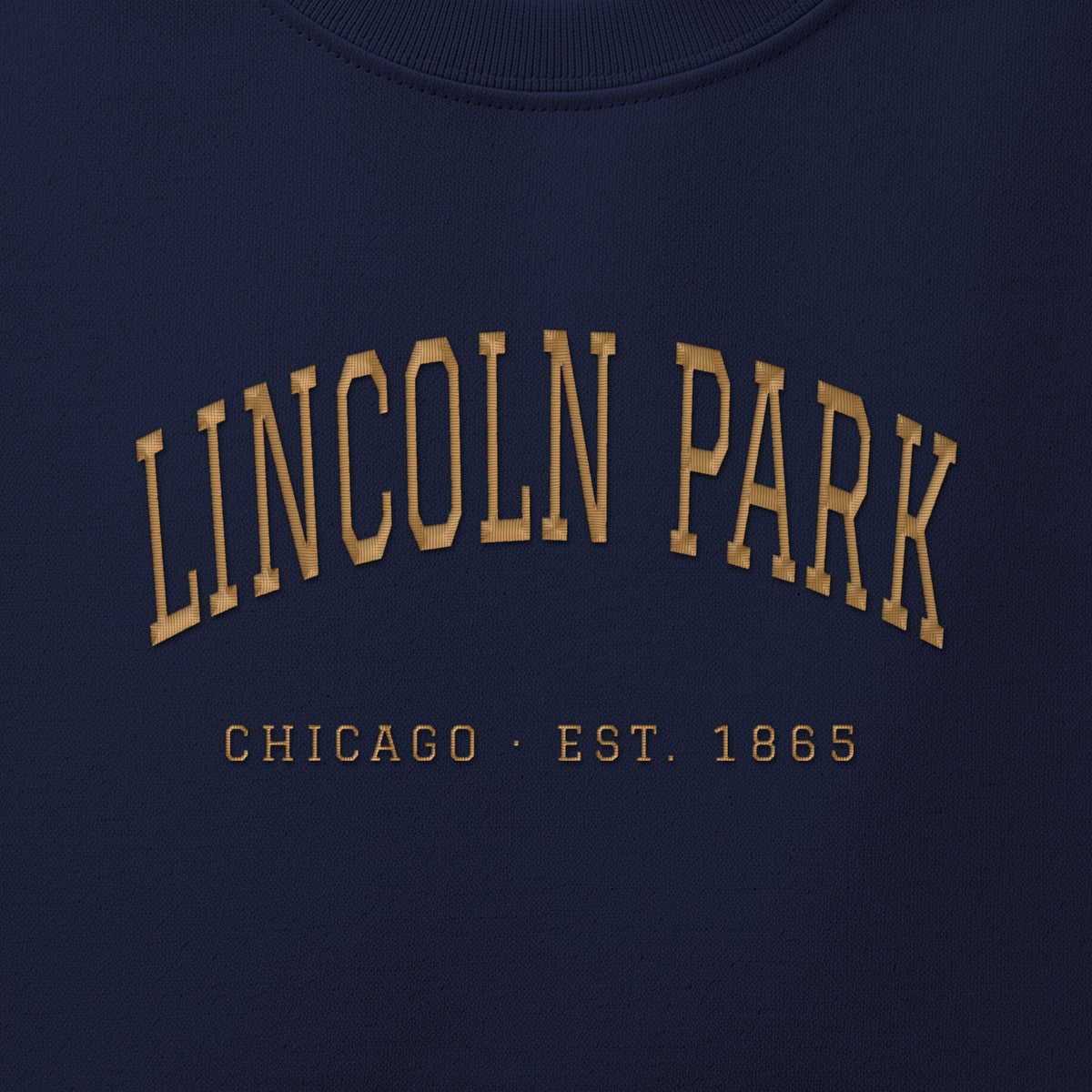 Close-up of gold satin-stitch Lincoln Park embroidery