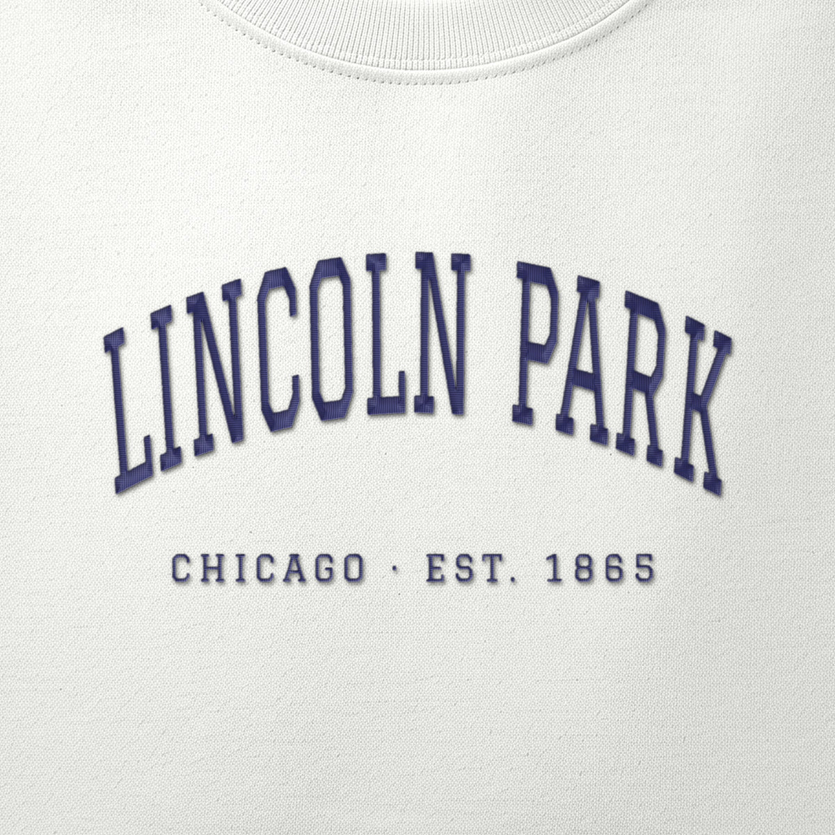 Close-up of navy satin-stitch Lincoln Park embroidery