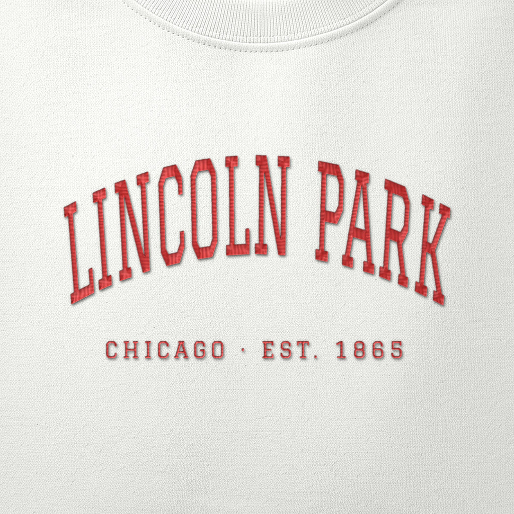 Close-up of red satin-stitch Lincoln Park embroidery