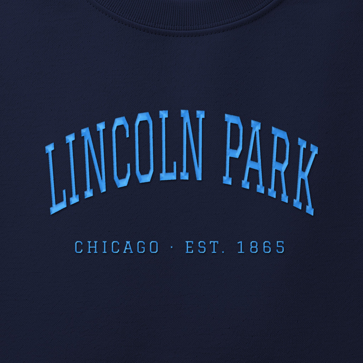 Close-up of sky blue satin-stitch Lincoln Park embroidery
