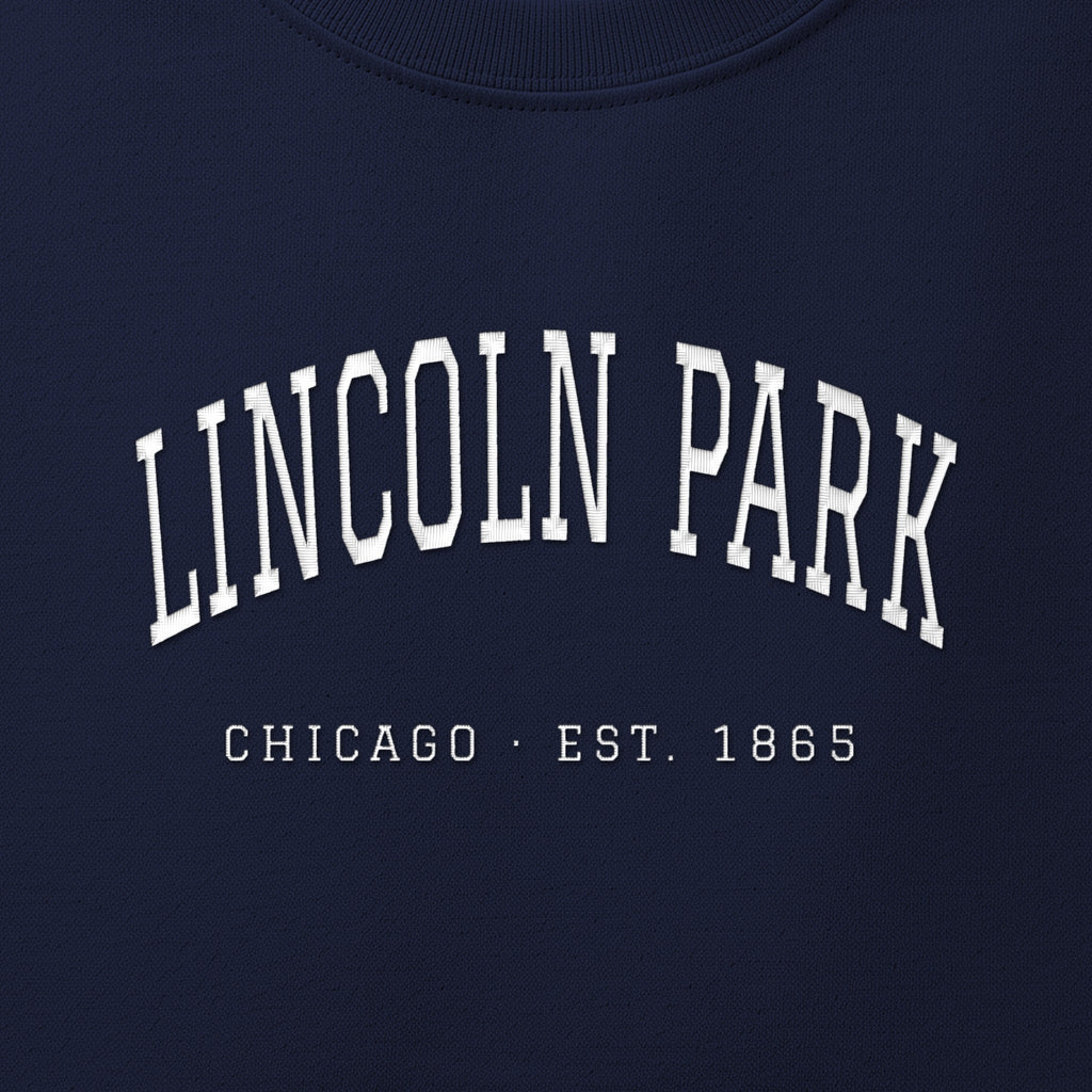 Close-up of white satin-stitch Lincoln Park embroidery
