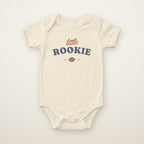 Little Rookie Bodysuit in Natural, flat lay on ivory