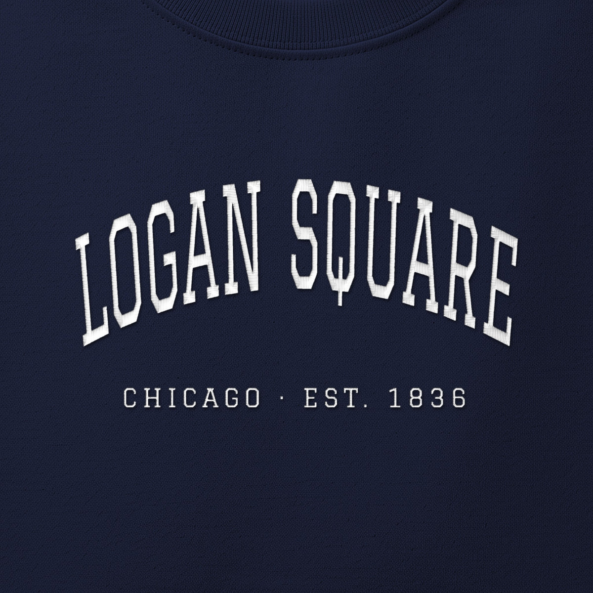Close-up of white satin-stitch Logan Square embroidery