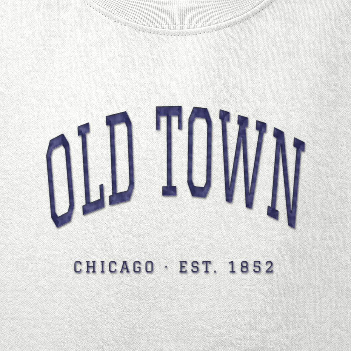 Close-up of navy satin-stitch Old Town embroidery