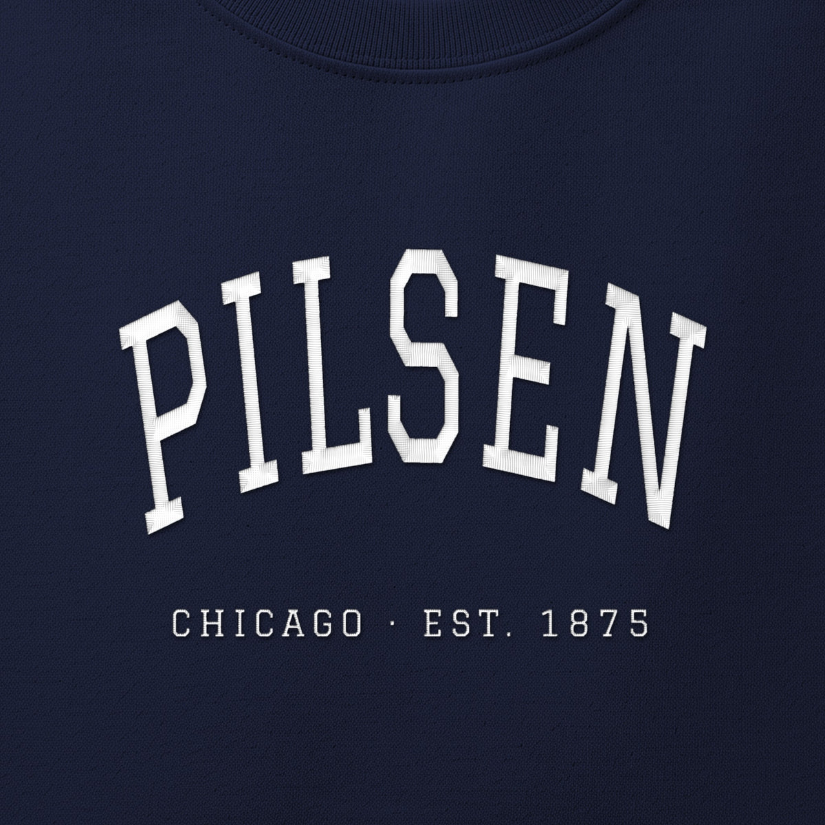 Close-up of white satin-stitch Pilsen embroidery