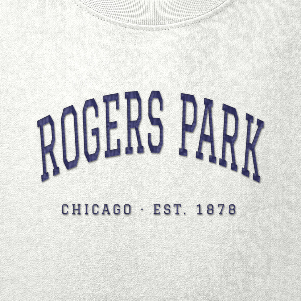 Close-up of navy satin-stitch Rogers Park embroidery