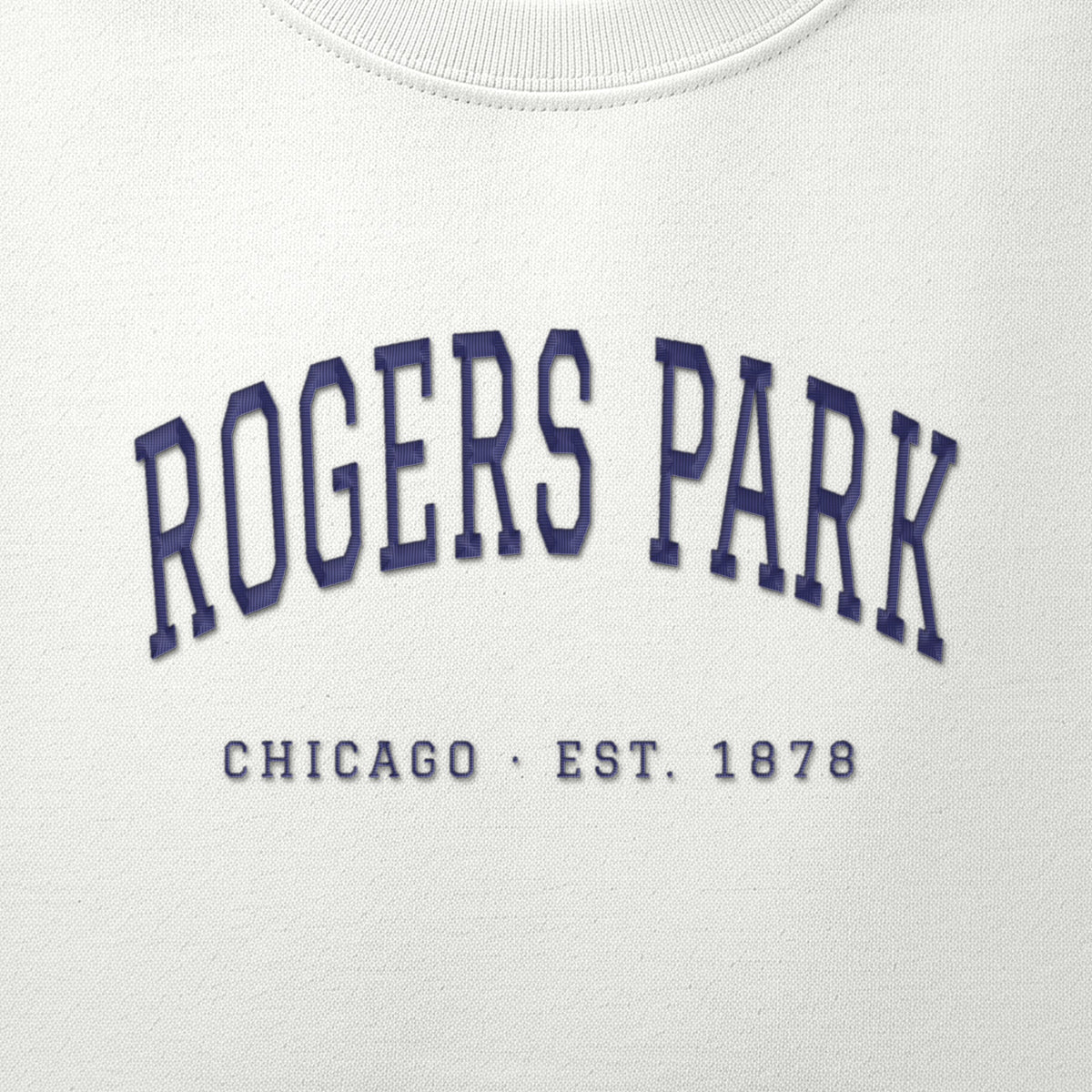 Close-up of navy satin-stitch Rogers Park embroidery