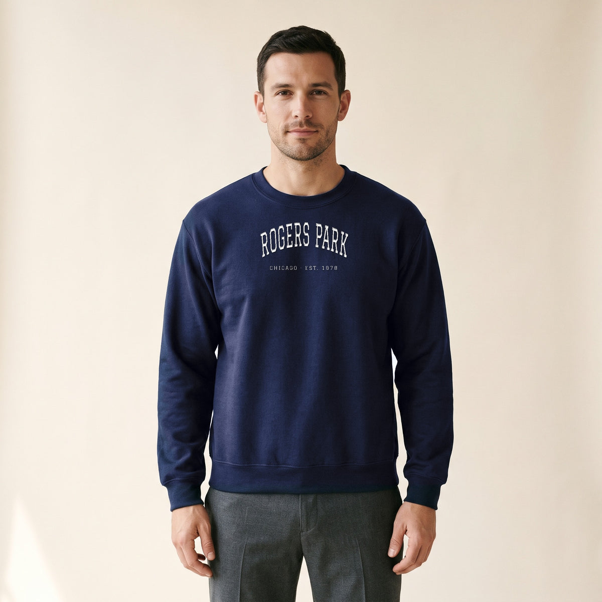Model wearing the Rogers Park Chicago Embroidered Crewneck — White Thread in Navy