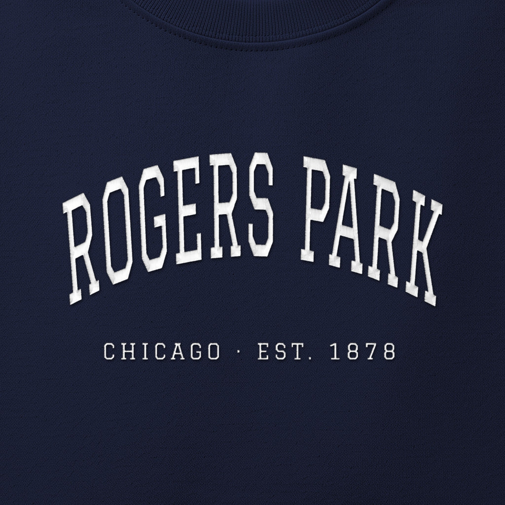 Close-up of white satin-stitch Rogers Park embroidery