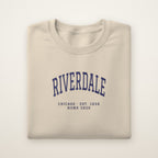 Riverdale Chicago Home 2026 Embroidered Crewneck — Navy Thread on Sand
