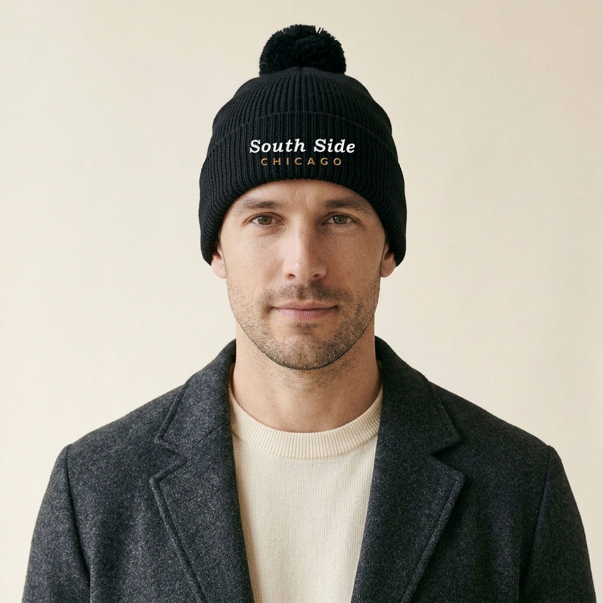 Model wearing the South Side Chicago Embroidered Pom-Pom Beanie in Black