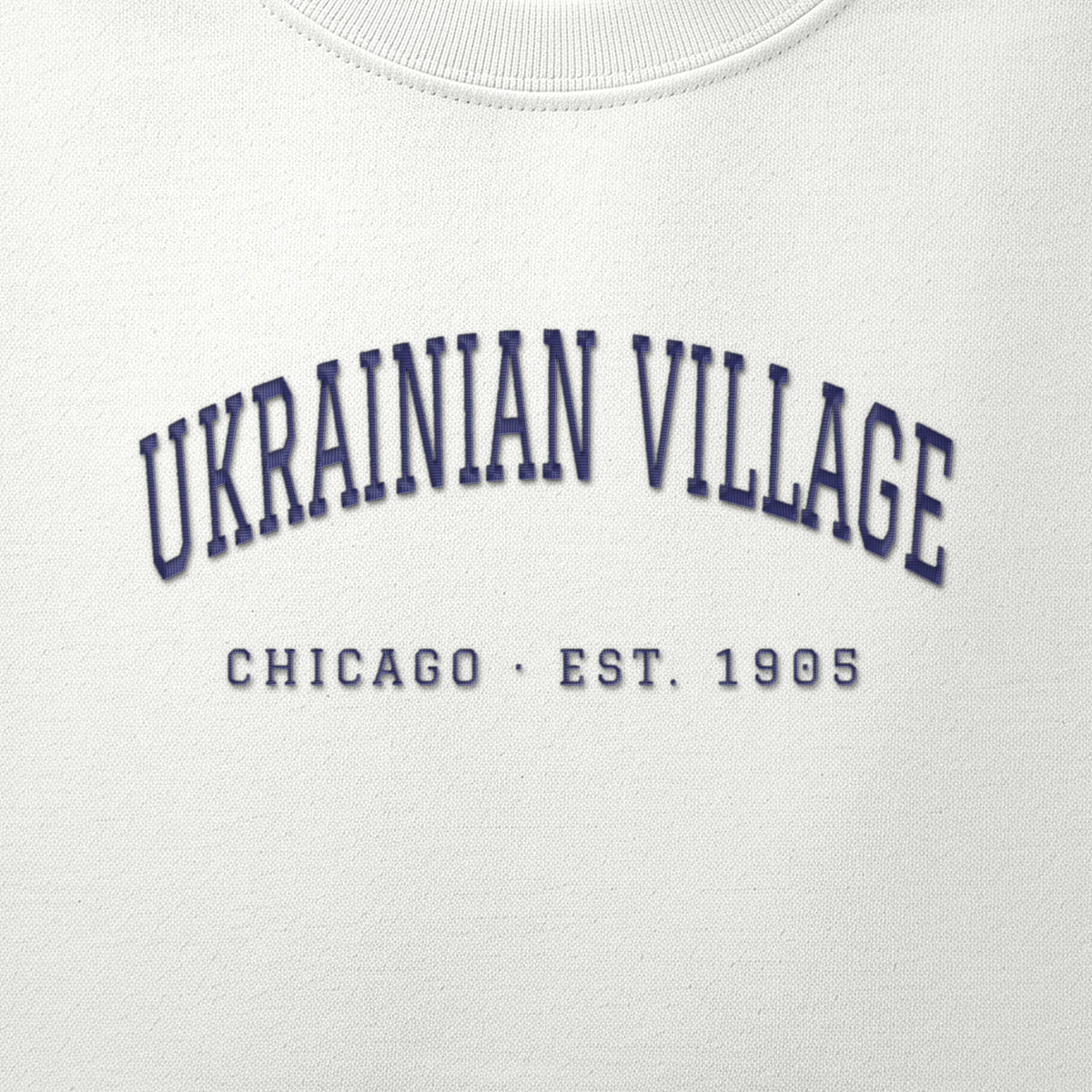 Close-up of navy satin-stitch Ukrainian Village embroidery