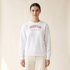 Model wearing the Ukrainian Village Chicago Embroidered Crewneck — Red Thread in White
