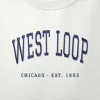 Close-up of navy satin-stitch West Loop embroidery