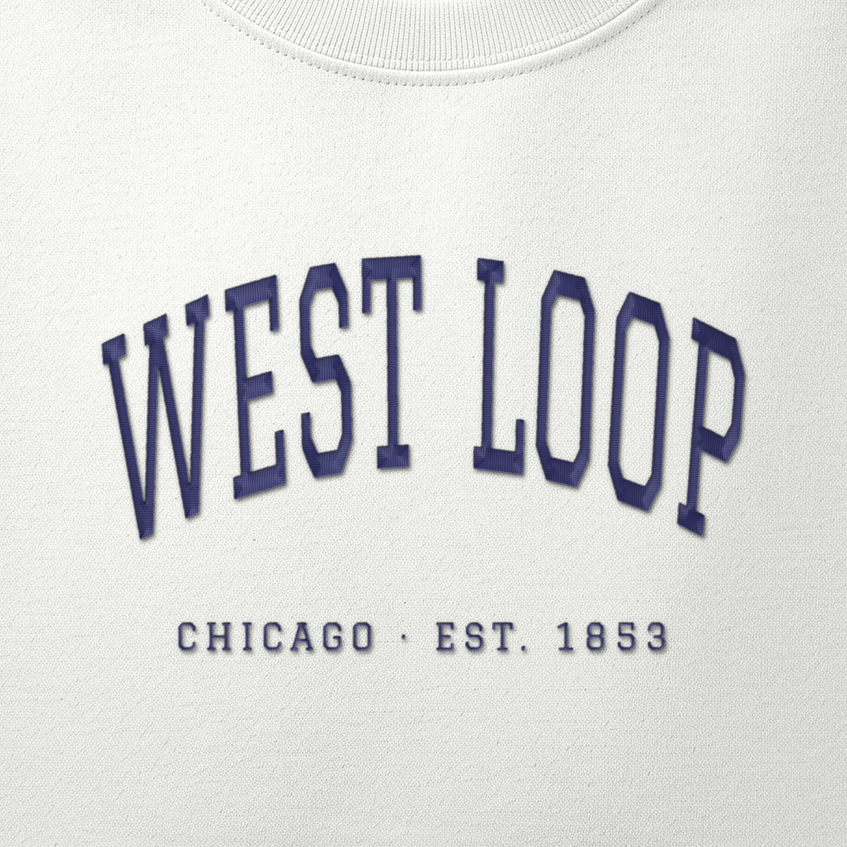 Close-up of navy satin-stitch West Loop embroidery