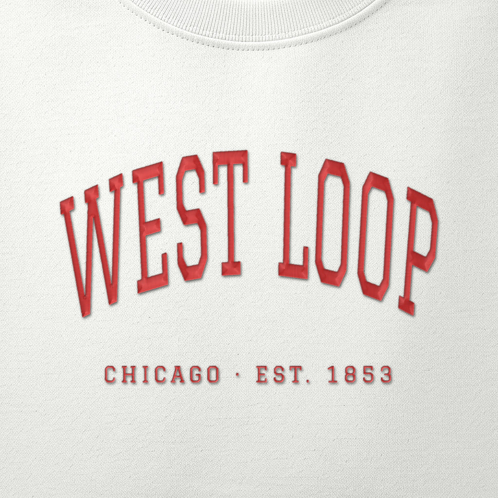 Close-up of red satin-stitch West Loop embroidery
