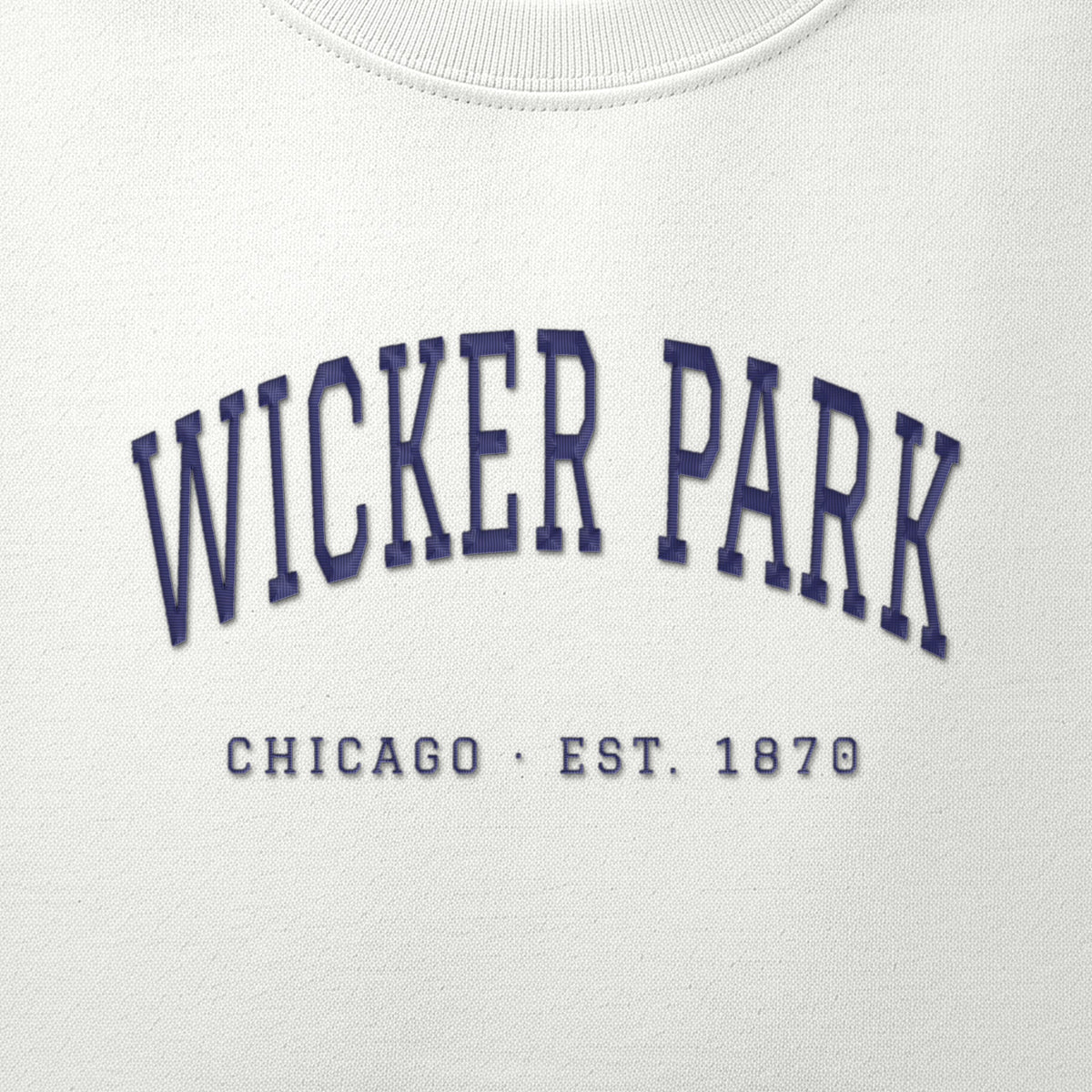 Close-up of navy satin-stitch Wicker Park embroidery