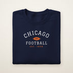 Youth Chicago Football Crewneck — Est. 1920 in Navy, flat lay on ivory